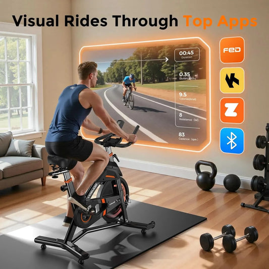 Person using a stationary bike with a screen displaying a virtual cycling experience, surrounded by fitness equipment.