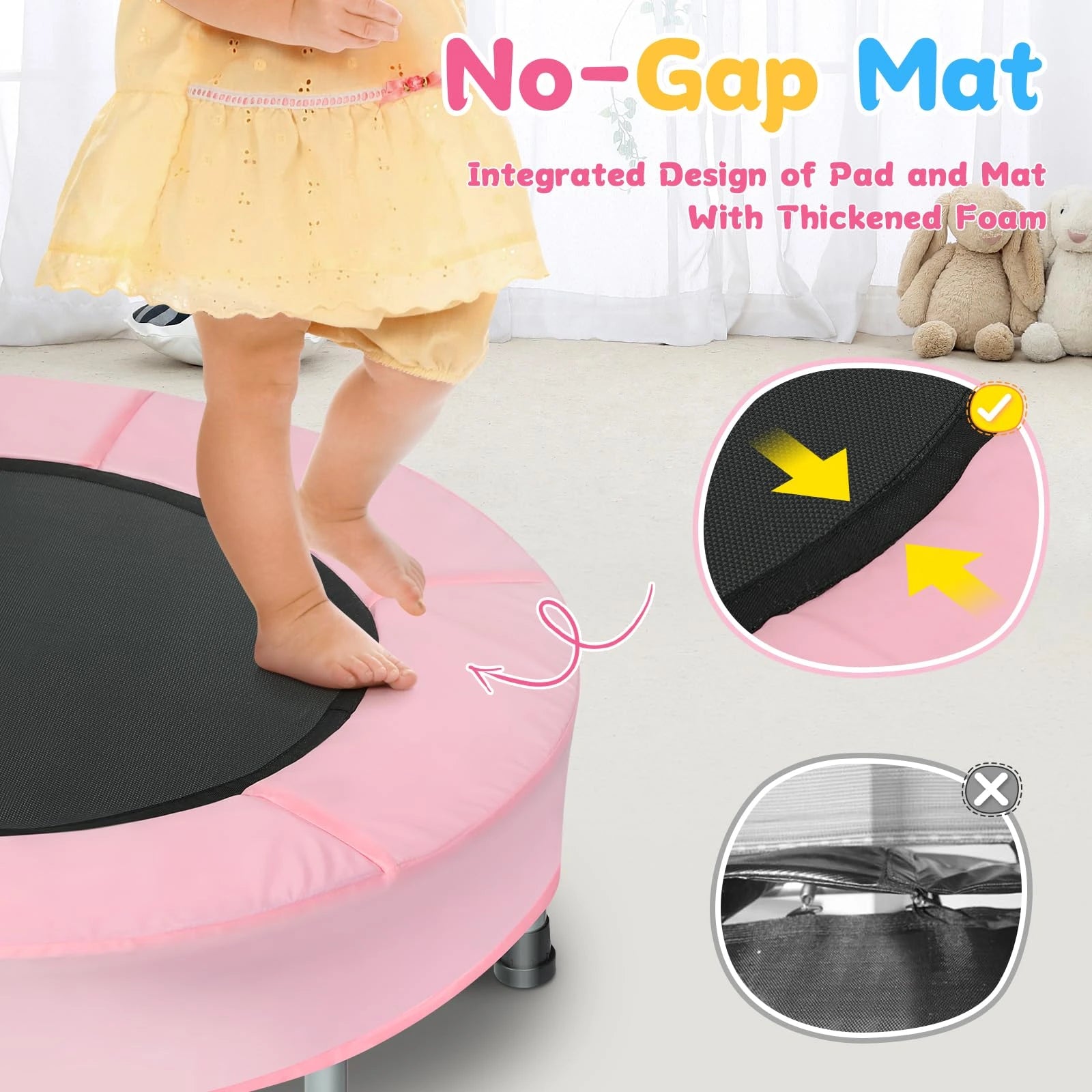 Pink trampoline with a child standing on it, highlighting the 'No-Gap Mat' feature.