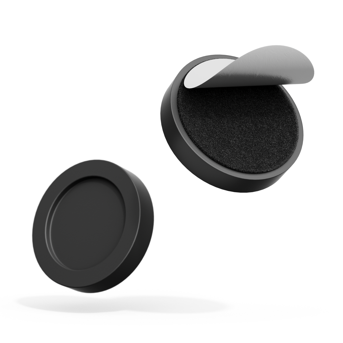 Two black round objects with one open to reveal a gray interior on a white background