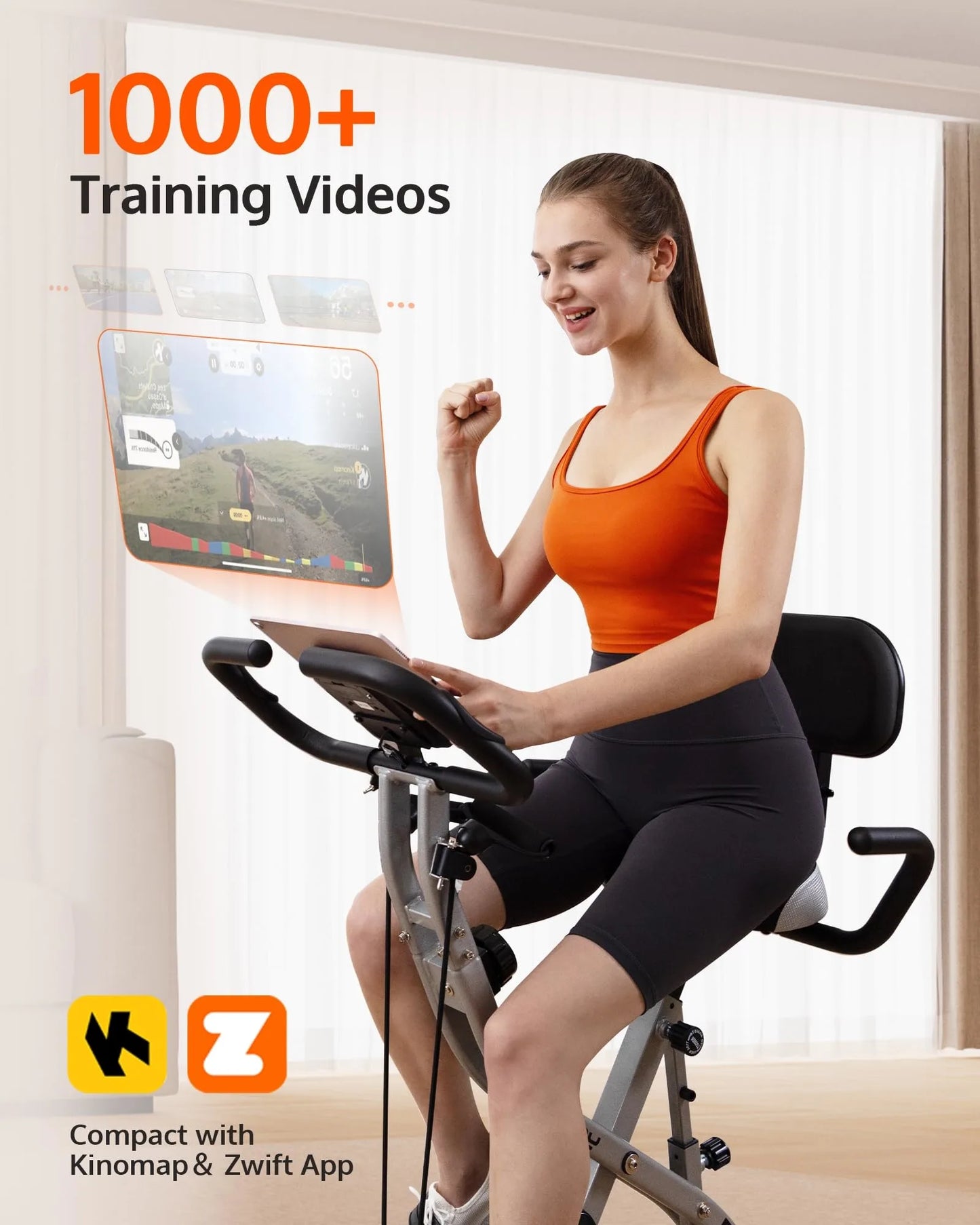 Woman using a stationary bike with a screen displaying training videos, indoors.