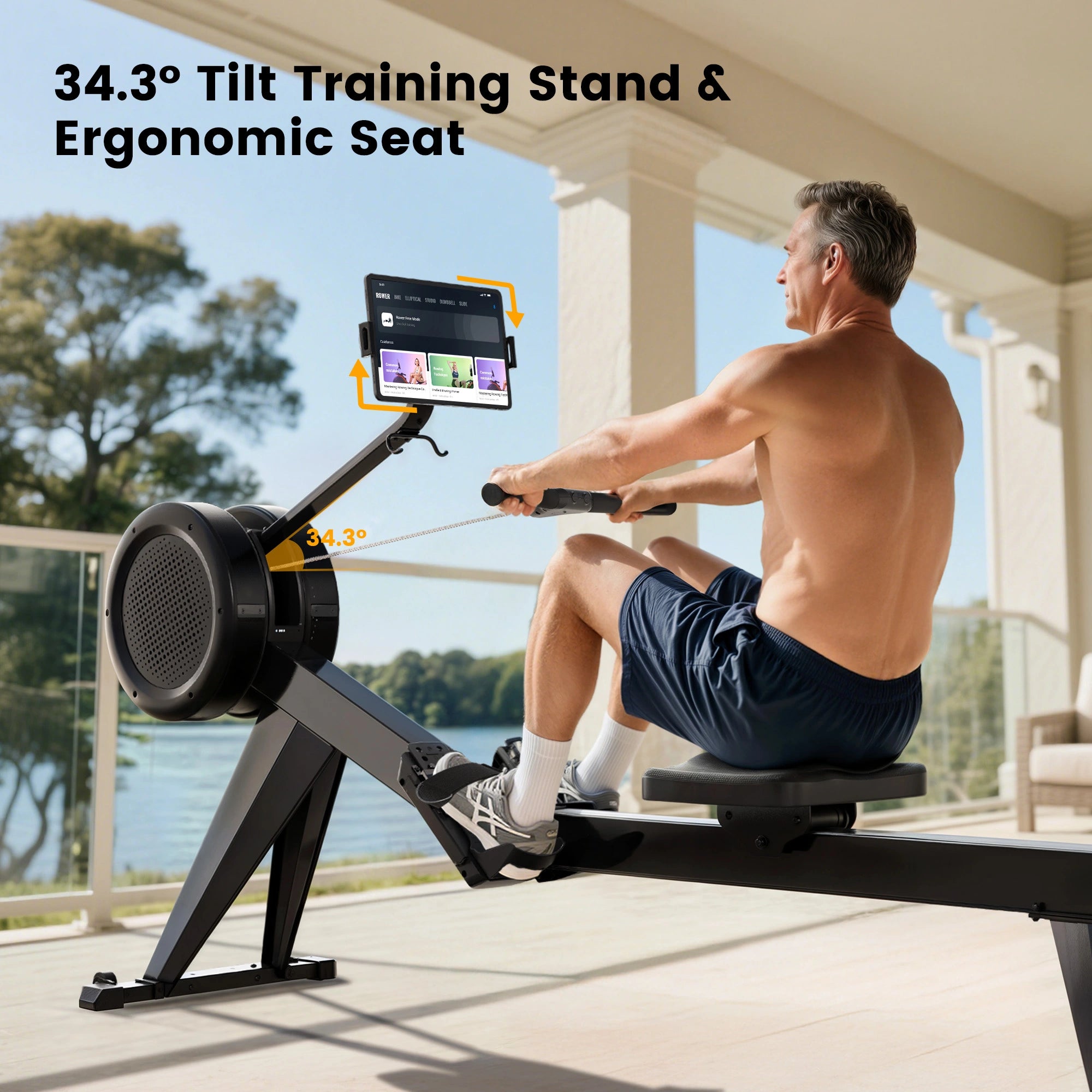 Man using a rowing machine with a tablet attached on a balcony