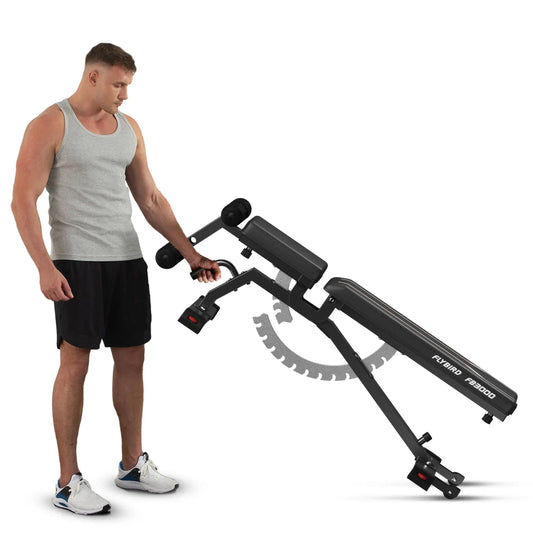 Man using a black adjustable workout bench on a white background