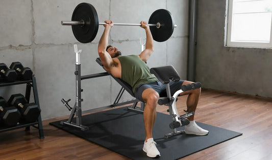 A man bench pressing on an adjustable workout bench
