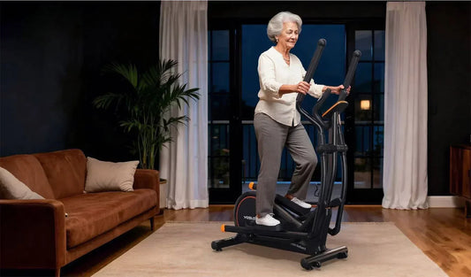 A senior is exercising on an elliptical machine