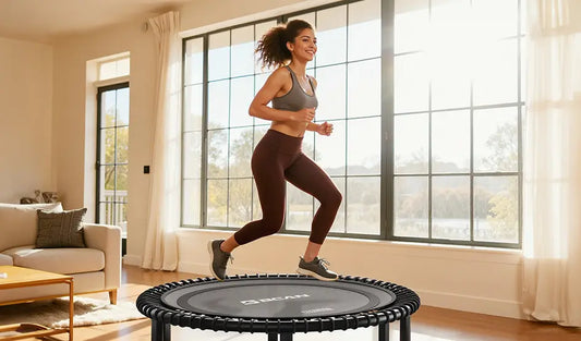 A woman is jogging leisurely on a mini trampoline in the living room