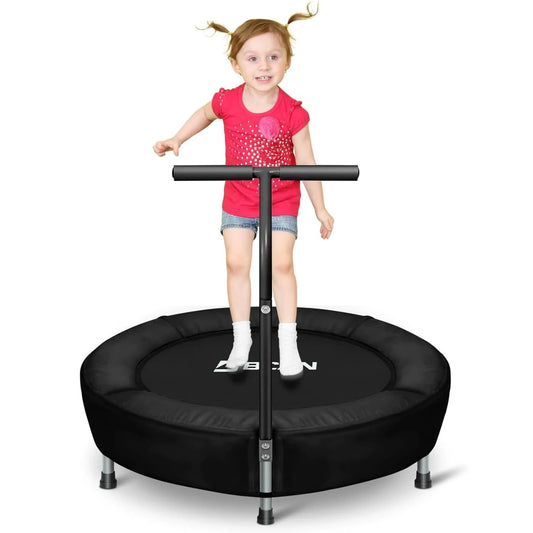 Child standing on a black trampoline with a white background