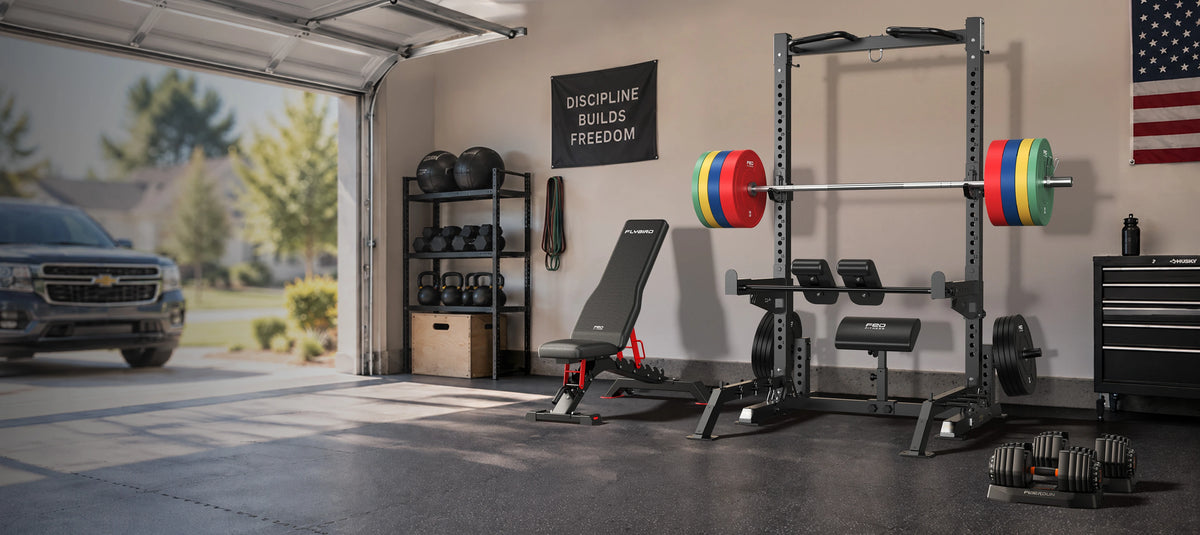FED Fitness home gym setup in a garage with SR2 All-in-One Squat Rack, WB7 Adjustable Utility Weight Bench, DB1 Quick Adjustable Dumbbell 52.5LBS, BA1 Training Bar and 2-Inch Olympic Bumper Plates.