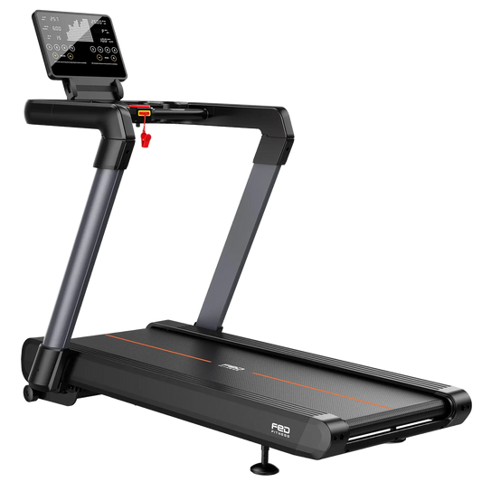 A folding treadmill shown at a three-quarter angle on a plain white background. The treadmill is primarily black with dark gray metallic arms and a thin orange accent line on the belt.