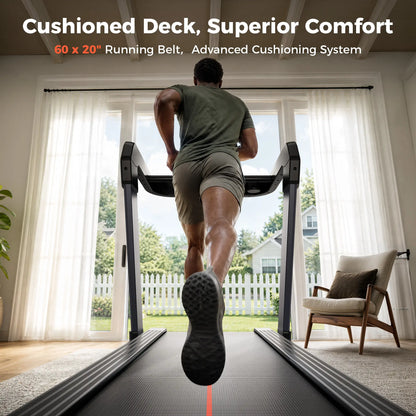 A man runs on a treadmill from behind in a bright home interior, with large windows, curtains, a chair, and outdoor greenery visible. White and orange text at the top reads: 'Cushioned Deck, Superior Comfort' and '60 x 20" Running Belt, Advanced Cushioning System.