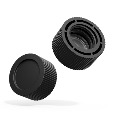 Two black cylindrical objects with textured surfaces on a white background