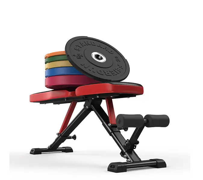 Red weight bench with black weight plates on a white background