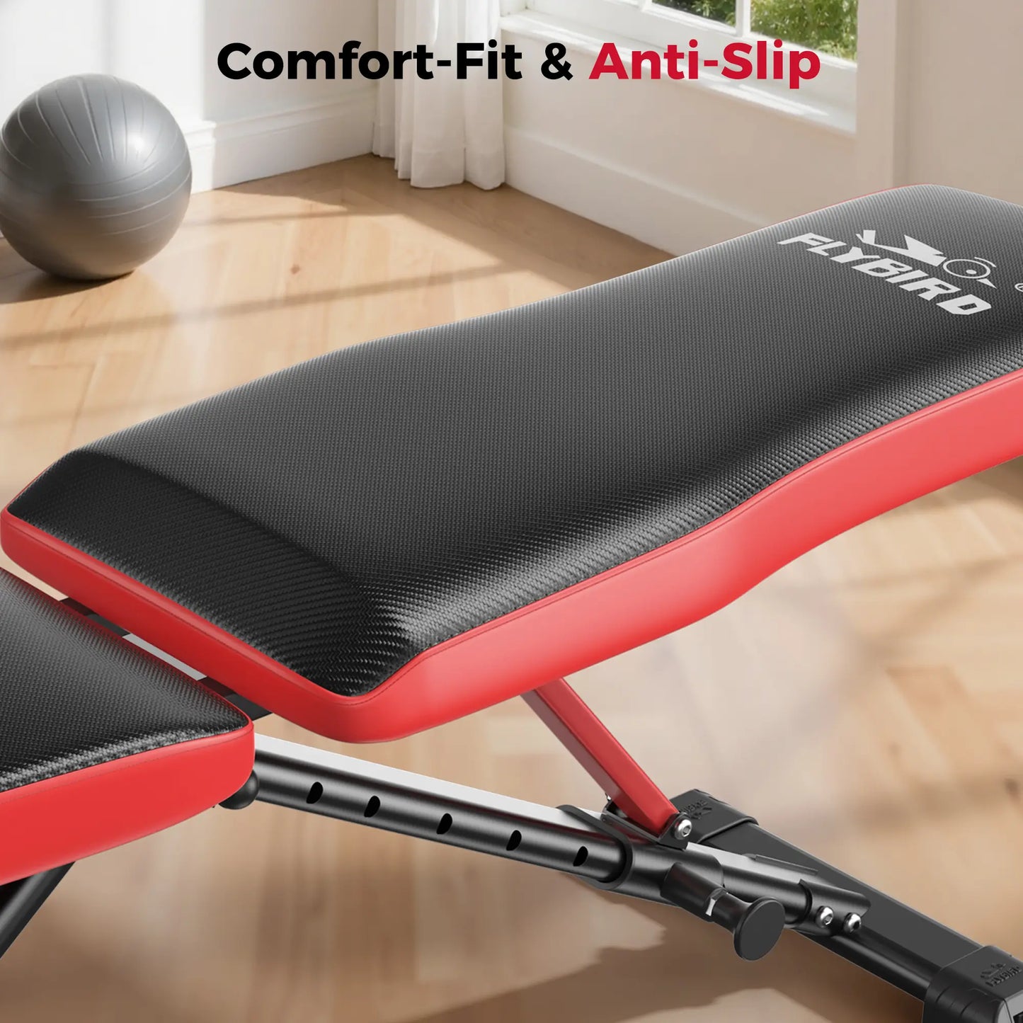 Red and black weight bench with 'FLVOIRD' branding in a home gym setting.