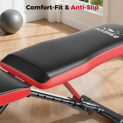 Red and black weight bench with 'FLVOIRD' branding in a home gym setting.