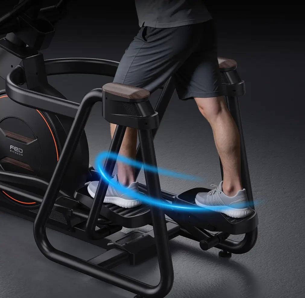Person using a black exercise bike with a dark background