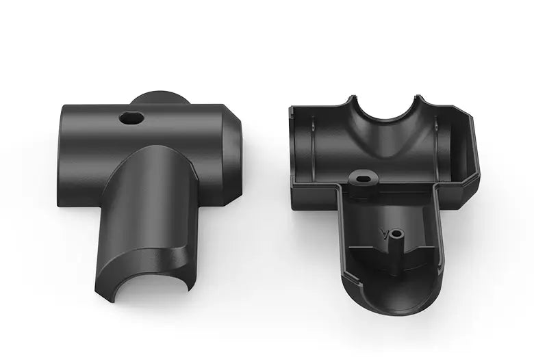 Two black plastic components on a white background