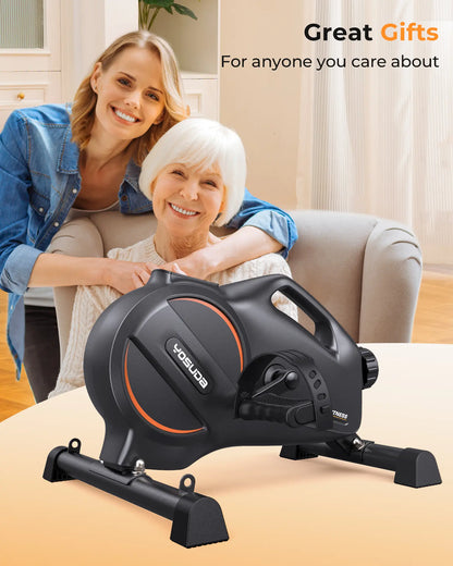 Two women with a Yosuda exercise bike in a home setting, promoting the bike as a gift.