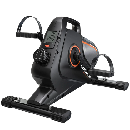 Black and orange exercise bike with digital display on a white background