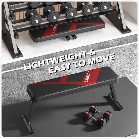 Foldable weight bench with red accents on a gray floor, surrounded by dumbbells.